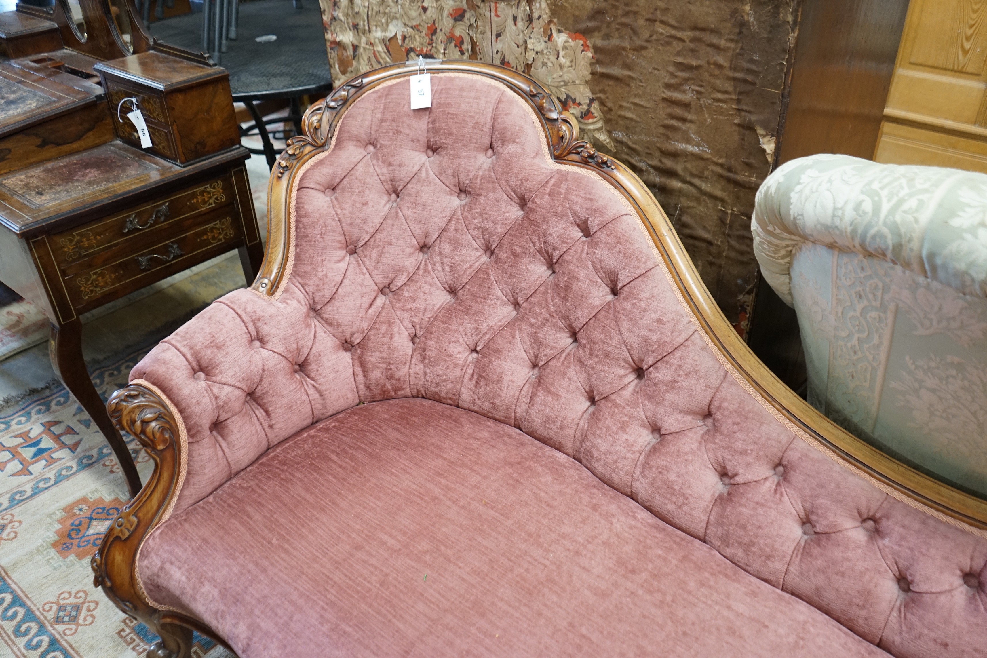 A Victorian faded rosewood chaise longue upholstered in buttoned pink dralon, length 190cm, width 80cm, height 88cm